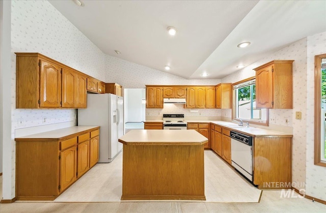 900 N Player Ave, Eagle, ID 83616 - kitchen featuring white appliances, wallpapered walls, a center island, a sink, and lofted ceiling