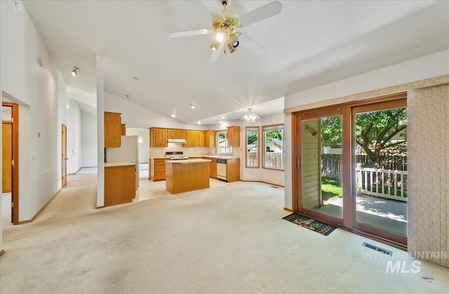 900 N Player Ave, Eagle, ID 83616 - kitchen with dishwashing machine, a center island, lofted ceiling, extractor fan, and light colored carpet