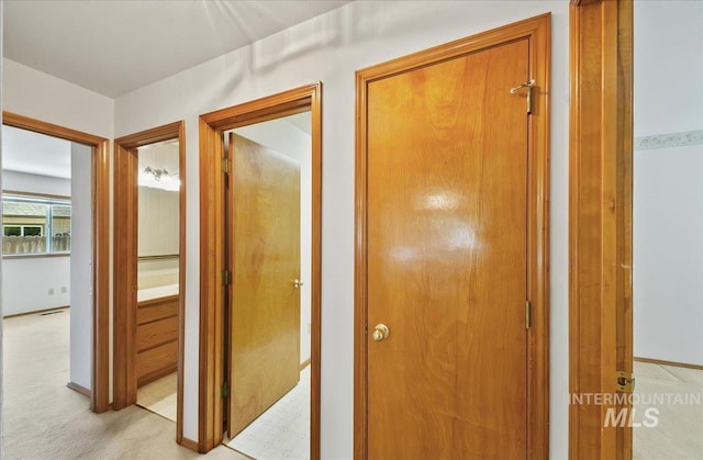 900 N Player Ave, Eagle, ID 83616 - hallway with baseboards and light colored carpet