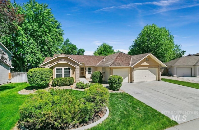 900 N Player Ave, Eagle, ID 83616 - ranch-style house with a garage, driveway, and stucco siding