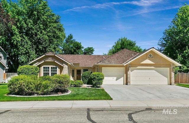 900 N Player Ave, Eagle, ID 83616 - single story home featuring an attached garage, driveway, stucco siding, and brick siding