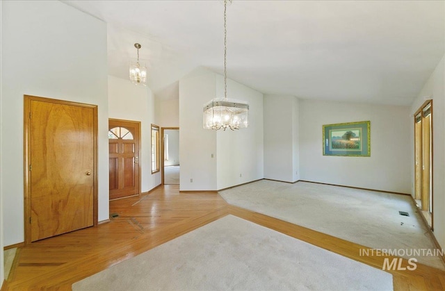 900 N Player Ave, Eagle, ID 83616 - unfurnished dining area with a chandelier, baseboards, and high vaulted ceiling