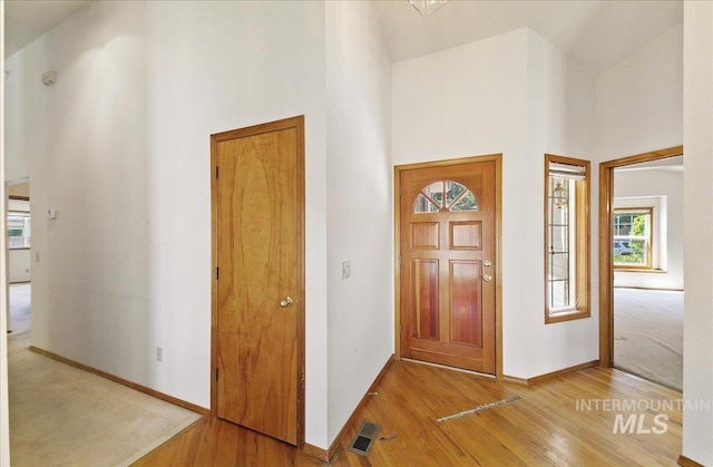 900 N Player Ave, Eagle, ID 83616 - foyer entrance with a towering ceiling, light wood-style floors, and baseboards