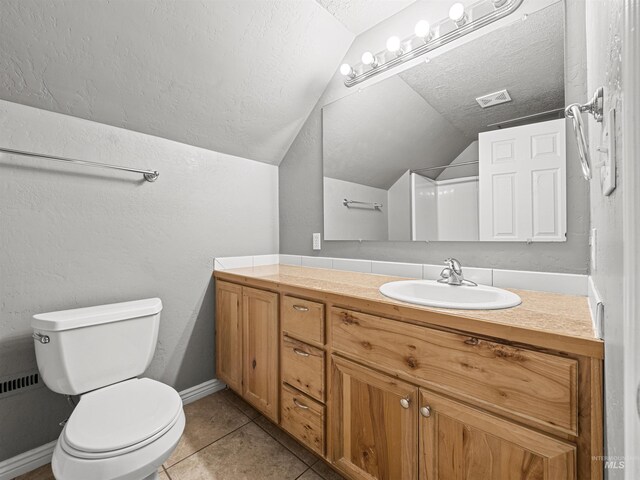 3500 W Overland, Boise, ID 83705 - full bath featuring vanity, vaulted ceiling, toilet, a textured ceiling, and tile patterned floors