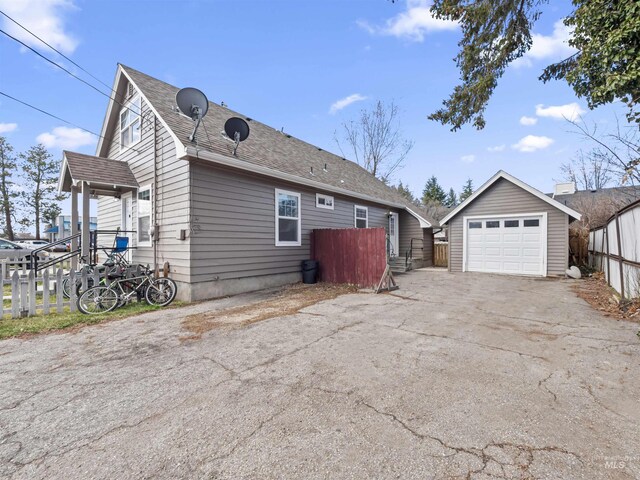 3500 W Overland, Boise, ID 83705 - view of home's exterior featuring driveway, an outbuilding, fence, and a detached garage