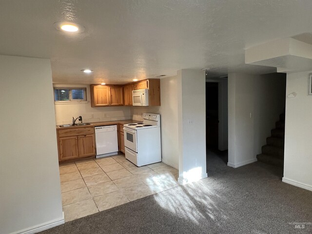 3500 W Overland, Boise, ID 83705 - kitchen with a sink, light carpet, baseboards, light tile patterned floors, and white appliances