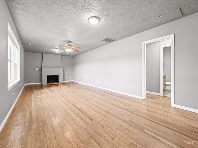 3500 W Overland, Boise, ID 83705 - unfurnished living room with a ceiling fan, baseboards, light wood finished floors, and visible vents
