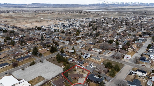 birds eye view of property featuring a mountain view and a residential view