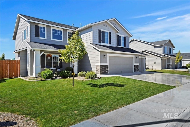 view of front facade with a garage and a front yard