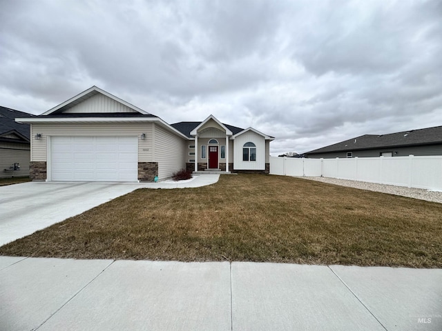 single story home featuring a garage and a front lawn