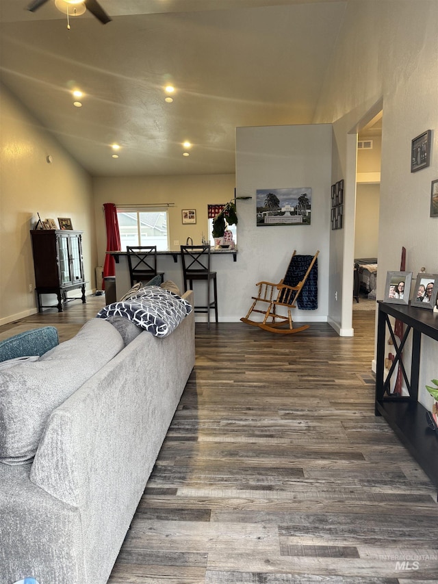 living room with ceiling fan and dark hardwood / wood-style floors