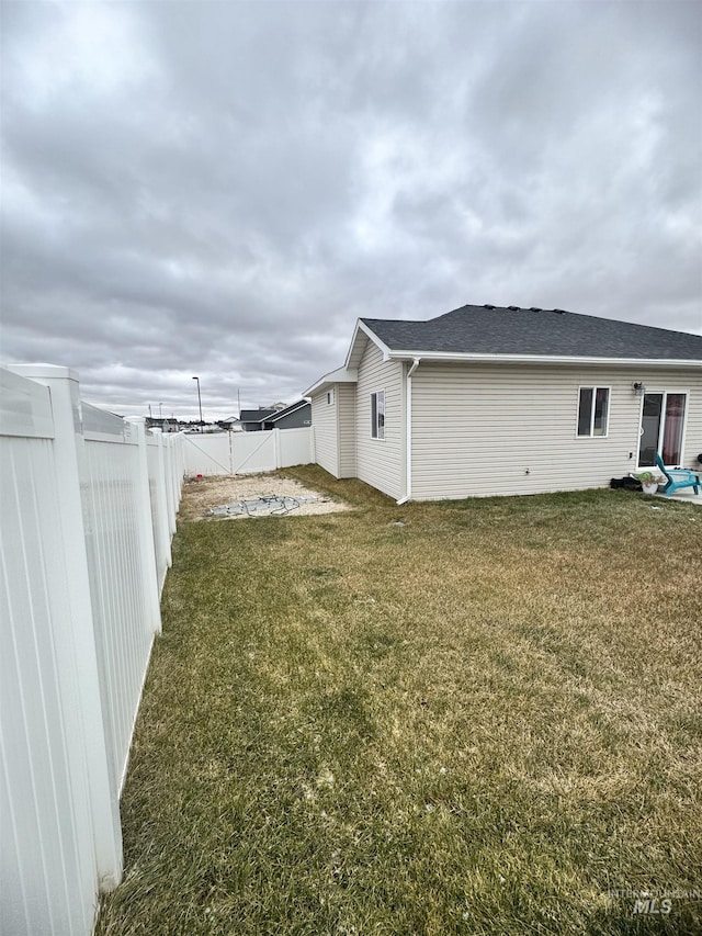 view of property exterior with a yard