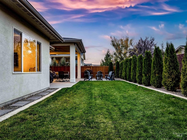 view of yard with a fenced backyard and a patio