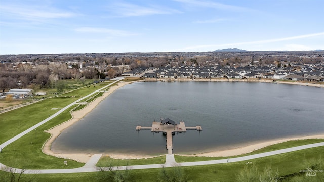 drone / aerial view featuring a water view and a residential view