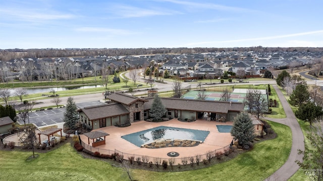 drone / aerial view featuring a water view and a residential view