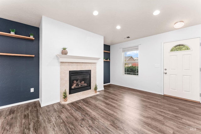 16170 Golddust Pl, Caldwell, ID 83607 - unfurnished living room with wood finished floors, recessed lighting, and a fireplace