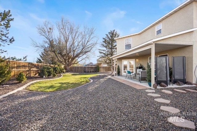 view of yard featuring a patio and a fenced backyard