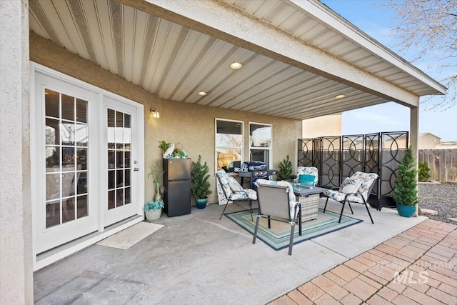 view of patio / terrace with fence