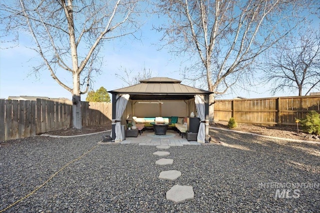 view of yard with a patio, a gazebo, a fenced backyard, and an outdoor hangout area