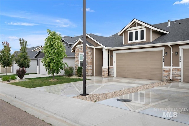 321 N Bay Haven Ave, Kuna, ID 83634 - craftsman house with stone siding, concrete driveway, roof with shingles, and board and batten siding