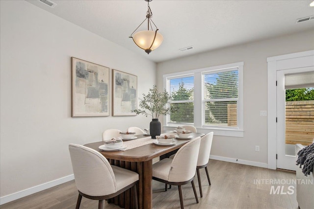321 N Bay Haven Ave, Kuna, ID 83634 - dining space with light wood-style flooring, plenty of natural light, and baseboards