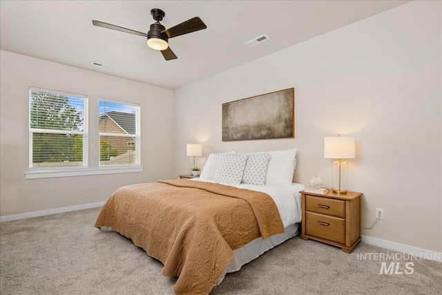 321 N Bay Haven Ave, Kuna, ID 83634 - bedroom with light colored carpet, baseboards, and ceiling fan