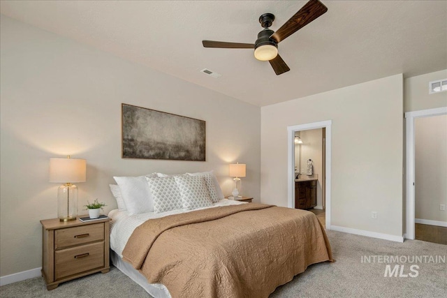 321 N Bay Haven Ave, Kuna, ID 83634 - bedroom with baseboards, light colored carpet, and ensuite bathroom