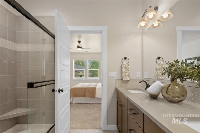 321 N Bay Haven Ave, Kuna, ID 83634 - ensuite bathroom featuring double vanity, a stall shower, and ceiling fan