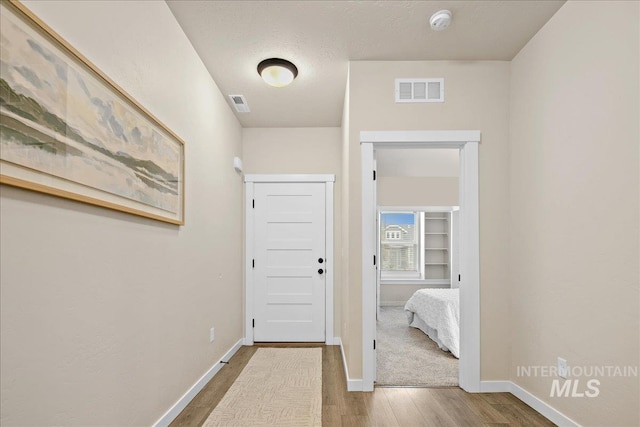 321 N Bay Haven Ave, Kuna, ID 83634 - corridor featuring wood finished floors and baseboards
