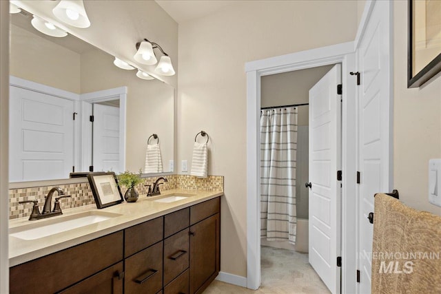 321 N Bay Haven Ave, Kuna, ID 83634 - bathroom featuring tasteful backsplash, double vanity, and a shower with shower curtain