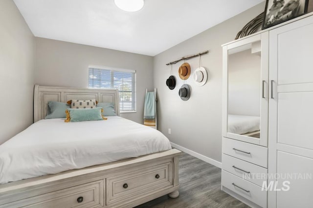 111 Main, Hagerman, ID 83332 - bedroom featuring dark wood-style flooring and baseboards