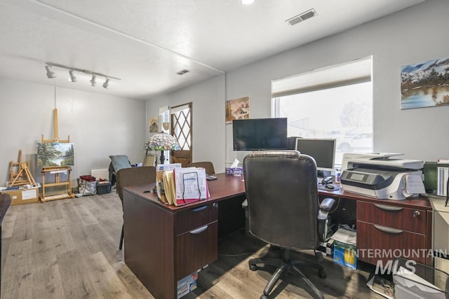 111 Main, Hagerman, ID 83332 - office space featuring wood finished floors, healthy amount of natural light, and rail lighting