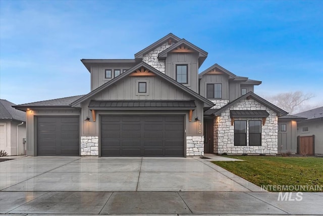craftsman-style house with stone siding, a garage, a front lawn, board and batten siding, and driveway