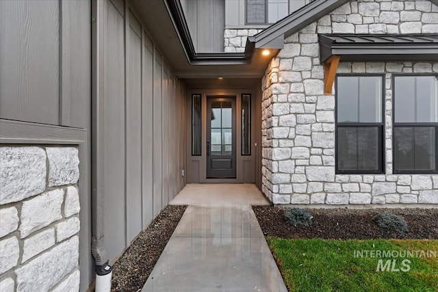 view of exterior entry with stone siding