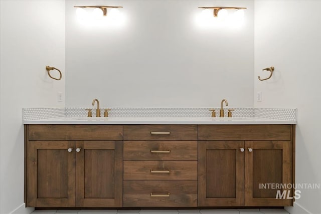bathroom with double vanity and a sink