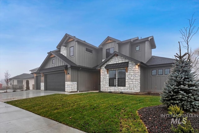 view of front facade featuring stone siding, an attached garage, concrete driveway, a front lawn, and board and batten siding