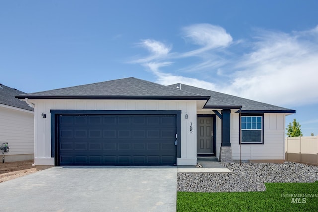 ranch-style house featuring a garage