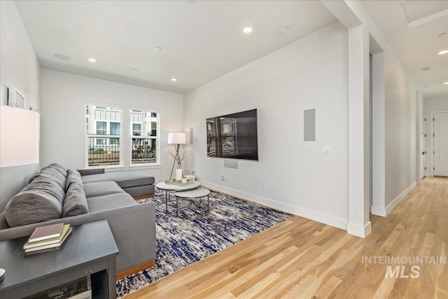 2391 S Trapper Pl, Boise, ID 83716 - living room featuring baseboards, recessed lighting, and light wood-style flooring