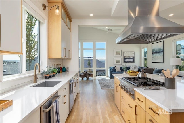 2391 S Trapper Pl, Boise, ID 83716 - kitchen featuring light brown cabinetry, open floor plan, a sink, and island range hood