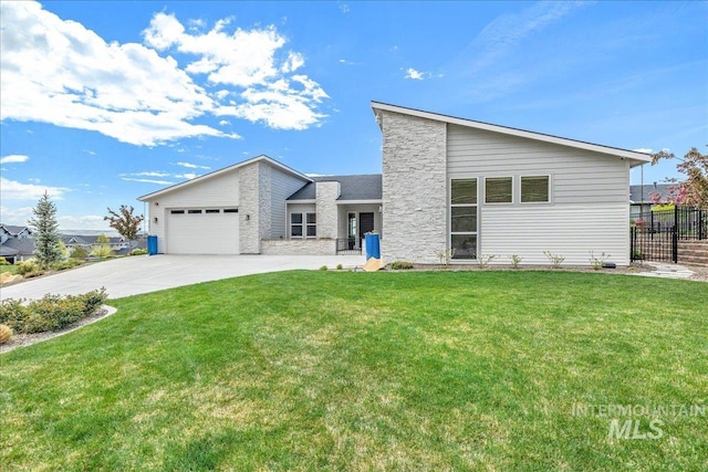 2391 S Trapper Pl, Boise, ID 83716 - view of front facade featuring a front lawn, fence, stone siding, and concrete driveway