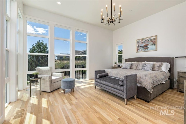 2391 S Trapper Pl, Boise, ID 83716 - bedroom with recessed lighting, a chandelier, and light wood finished floors