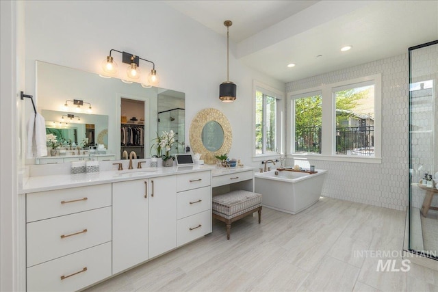 2391 S Trapper Pl, Boise, ID 83716 - full bathroom with a freestanding bath, vanity, a shower stall, and recessed lighting