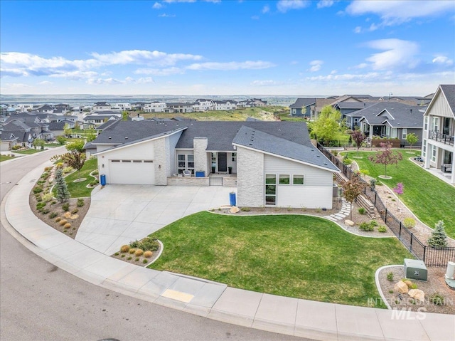 2391 S Trapper Pl, Boise, ID 83716 - view of front of home with a residential view, fence, an attached garage, and driveway