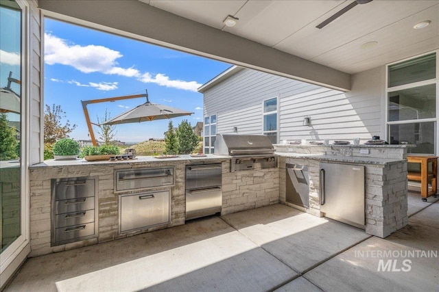 2391 S Trapper Pl, Boise, ID 83716 - view of patio featuring an outdoor kitchen, outdoor wet bar, and a grill