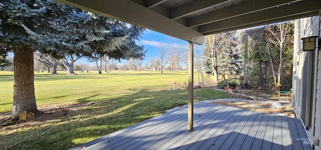 wooden deck featuring a yard