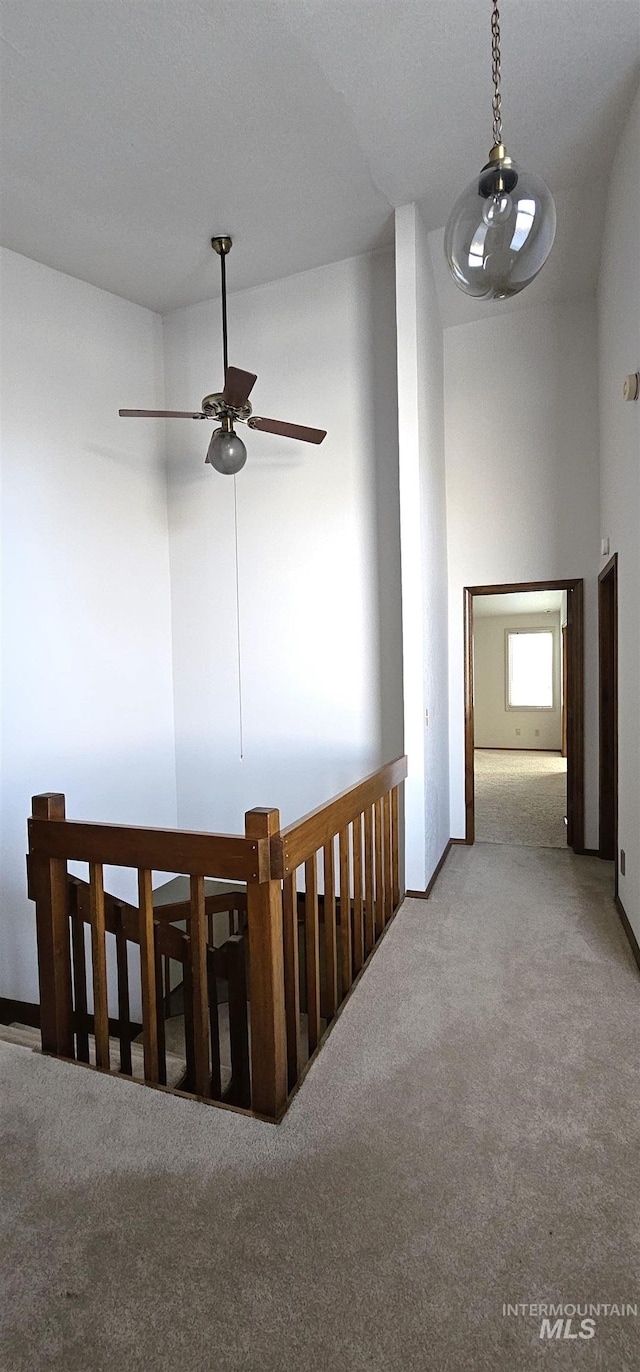 corridor featuring light carpet