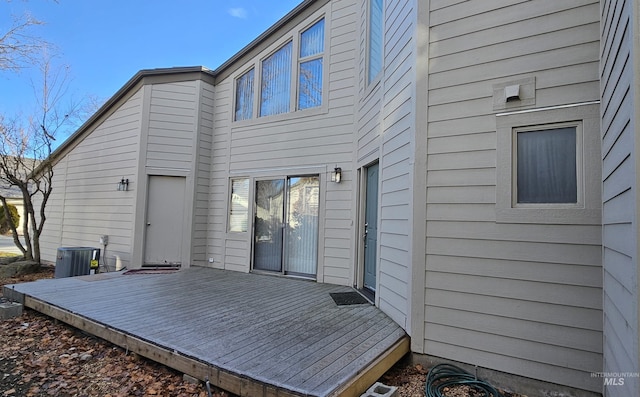 back of property featuring a wooden deck and central AC unit