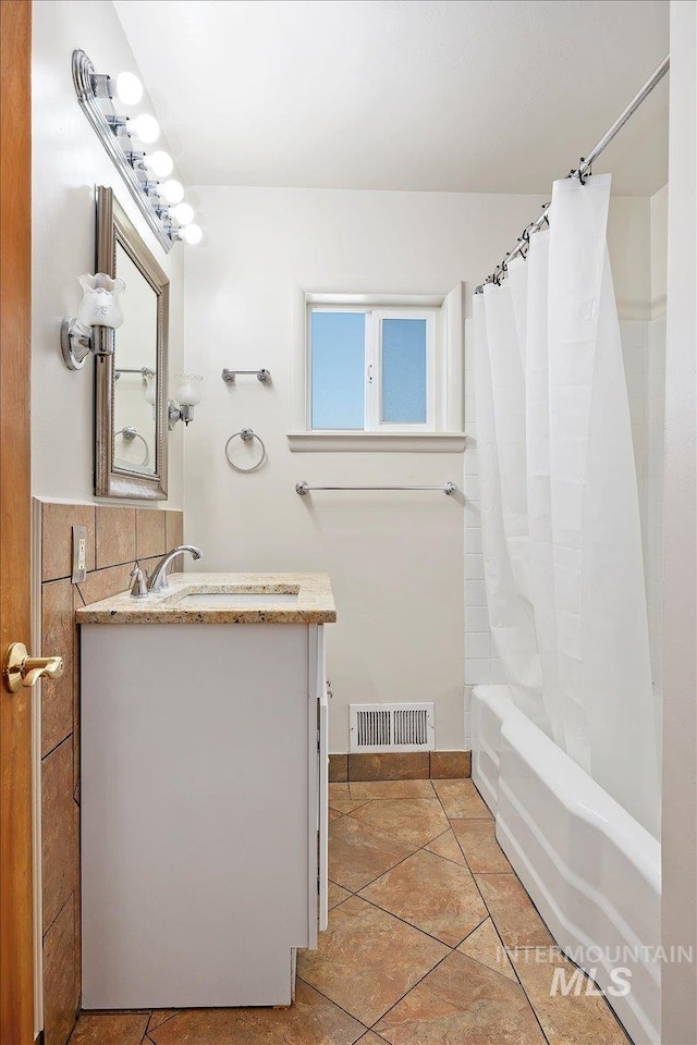 1341 N Fillmore, Jerome, ID 83338 - full bathroom with vanity, shower / bath combo with shower curtain, and tile patterned floors