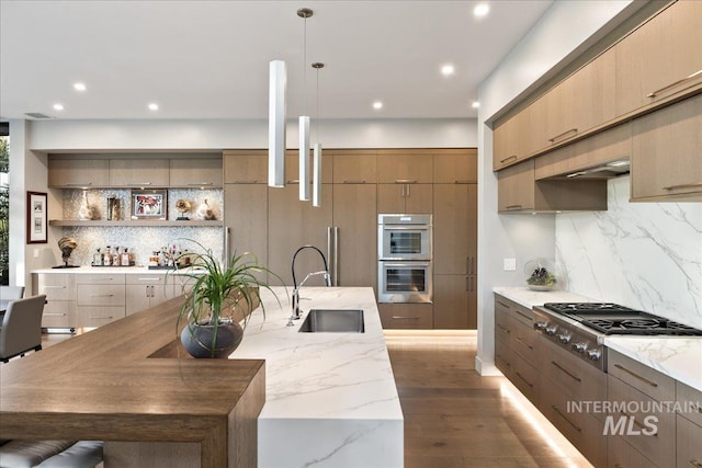 1865 E Lone Shore Ln, Eagle, ID 83616 - kitchen with recessed lighting, a sink, appliances with stainless steel finishes, and backsplash