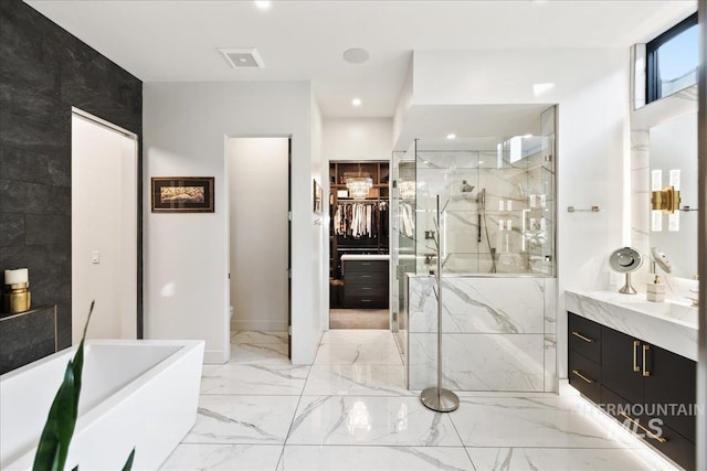 1865 E Lone Shore Ln, Eagle, ID 83616 - full bathroom featuring a freestanding tub, vanity, marble finish floor, a marble finish shower, and recessed lighting